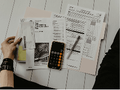 Paperwork and a calculator on a desk