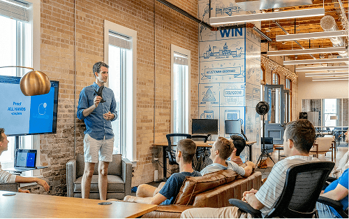 Dealer team collaborating in a modern workspace environment