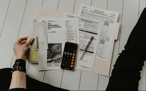 Paperwork and a calculator on a desk