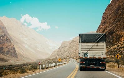 A truck driving along a mountain highway