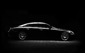 The side profile of a dark car
